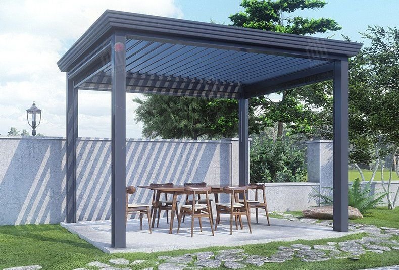 Dark grey louvered pergola over an outdoor dining area